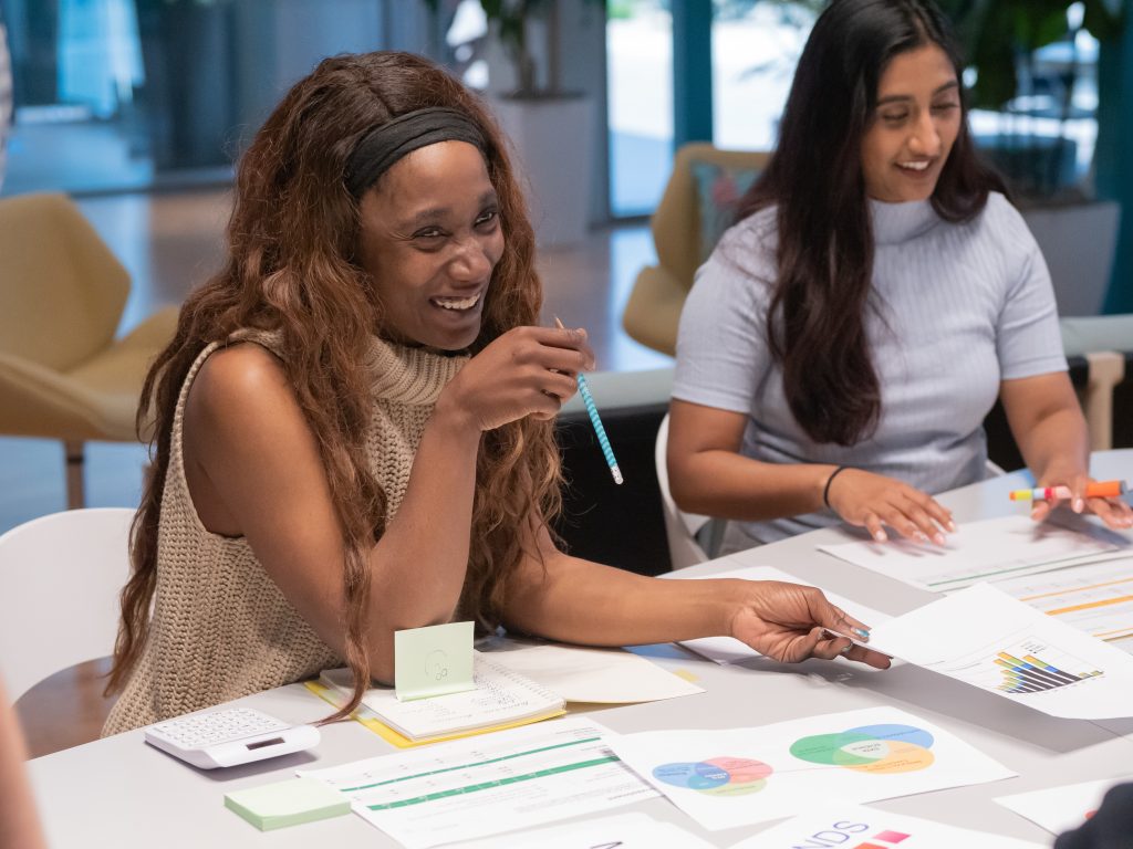 two female accountants having a meeting with their clients