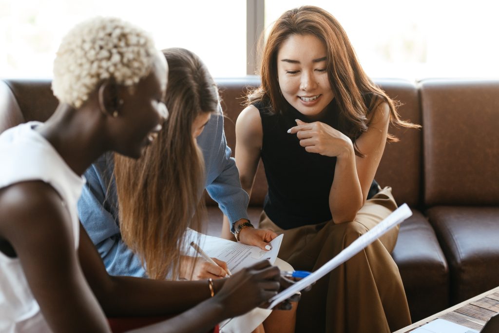 three female accountants checking the report