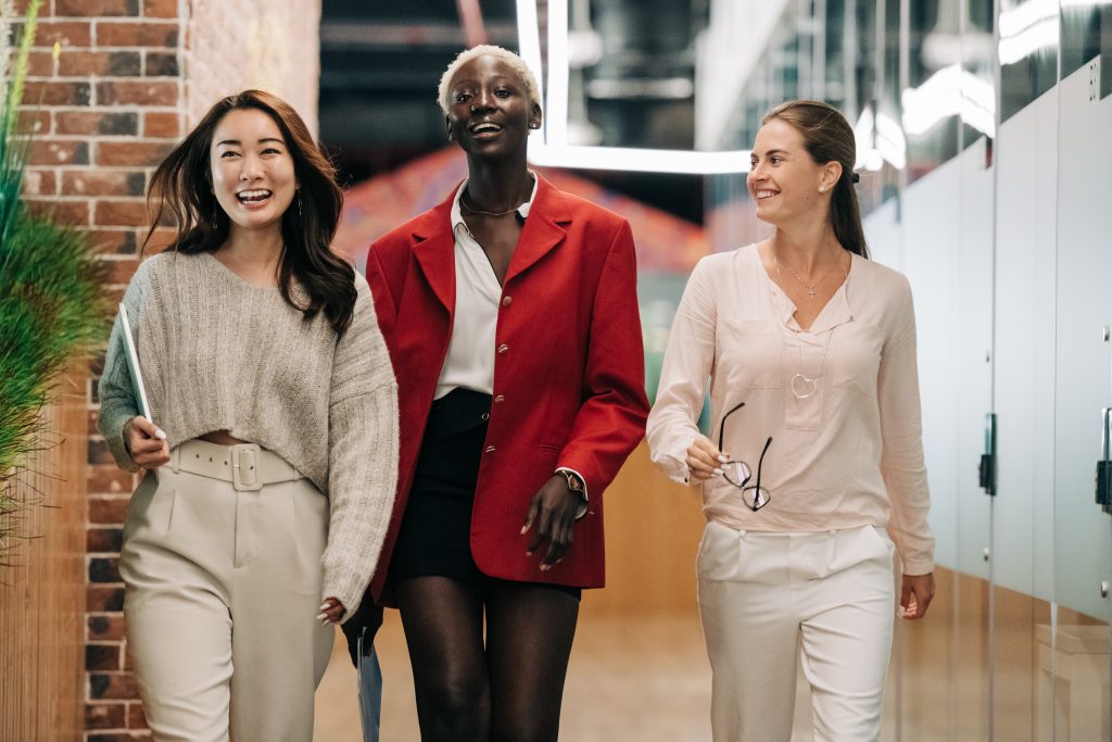 three accountants walking outside their office