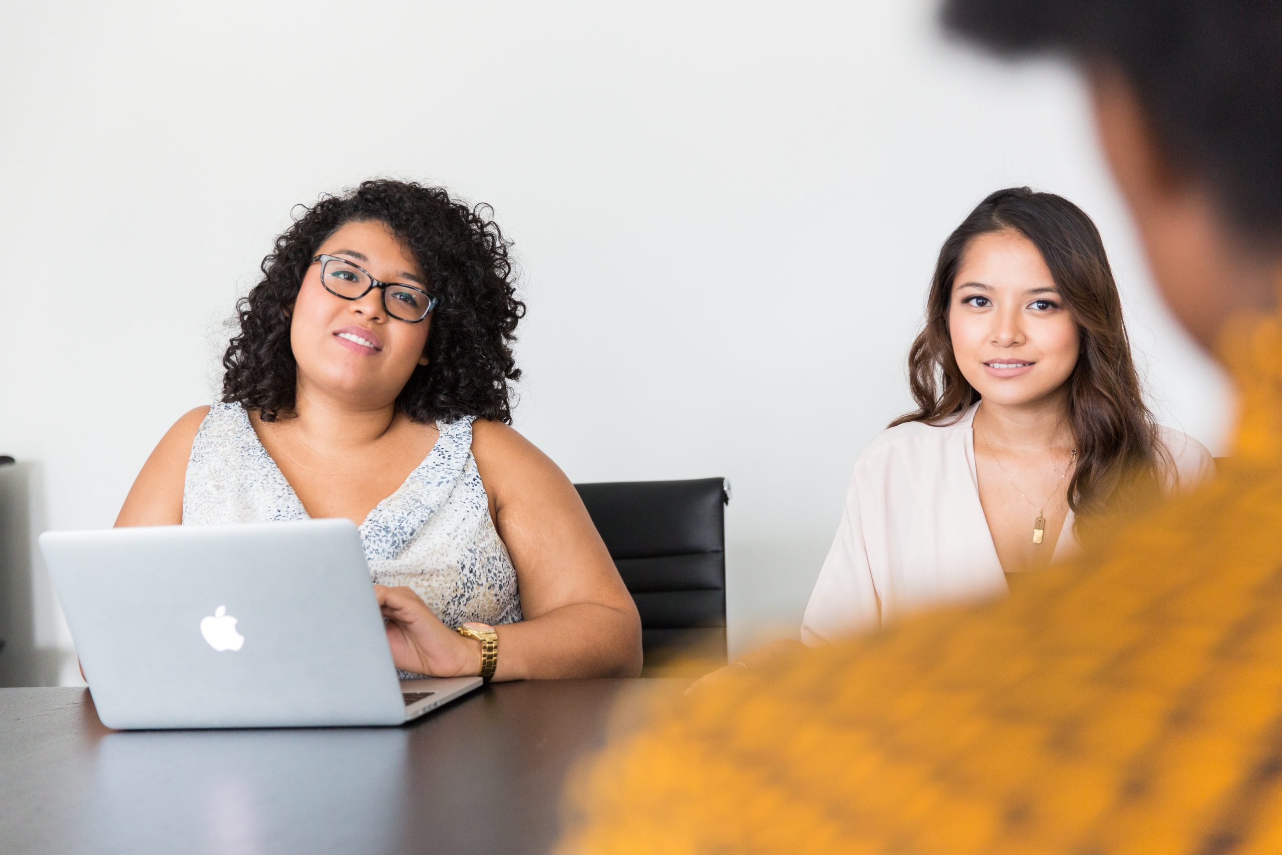 female accountants speaking with their client