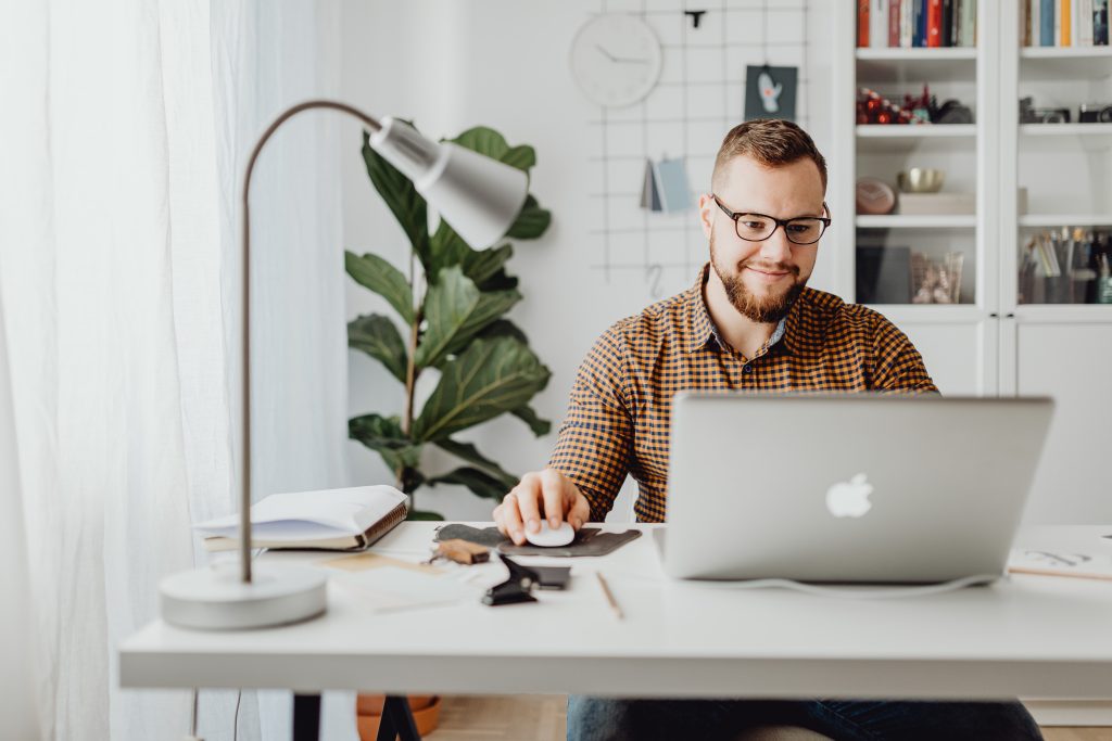 accountant working with a macbook laptop