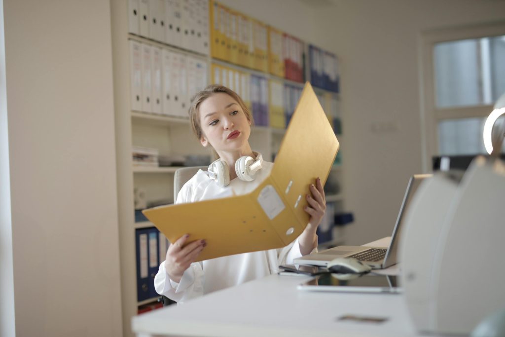 accountant checking a file folder