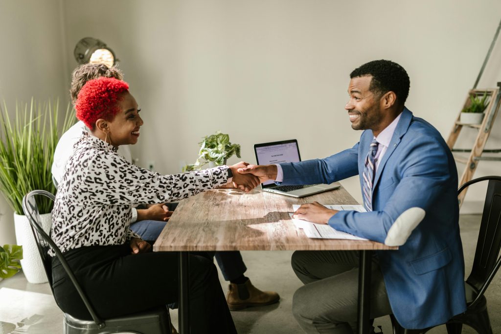 accountant shaking the hands of his client