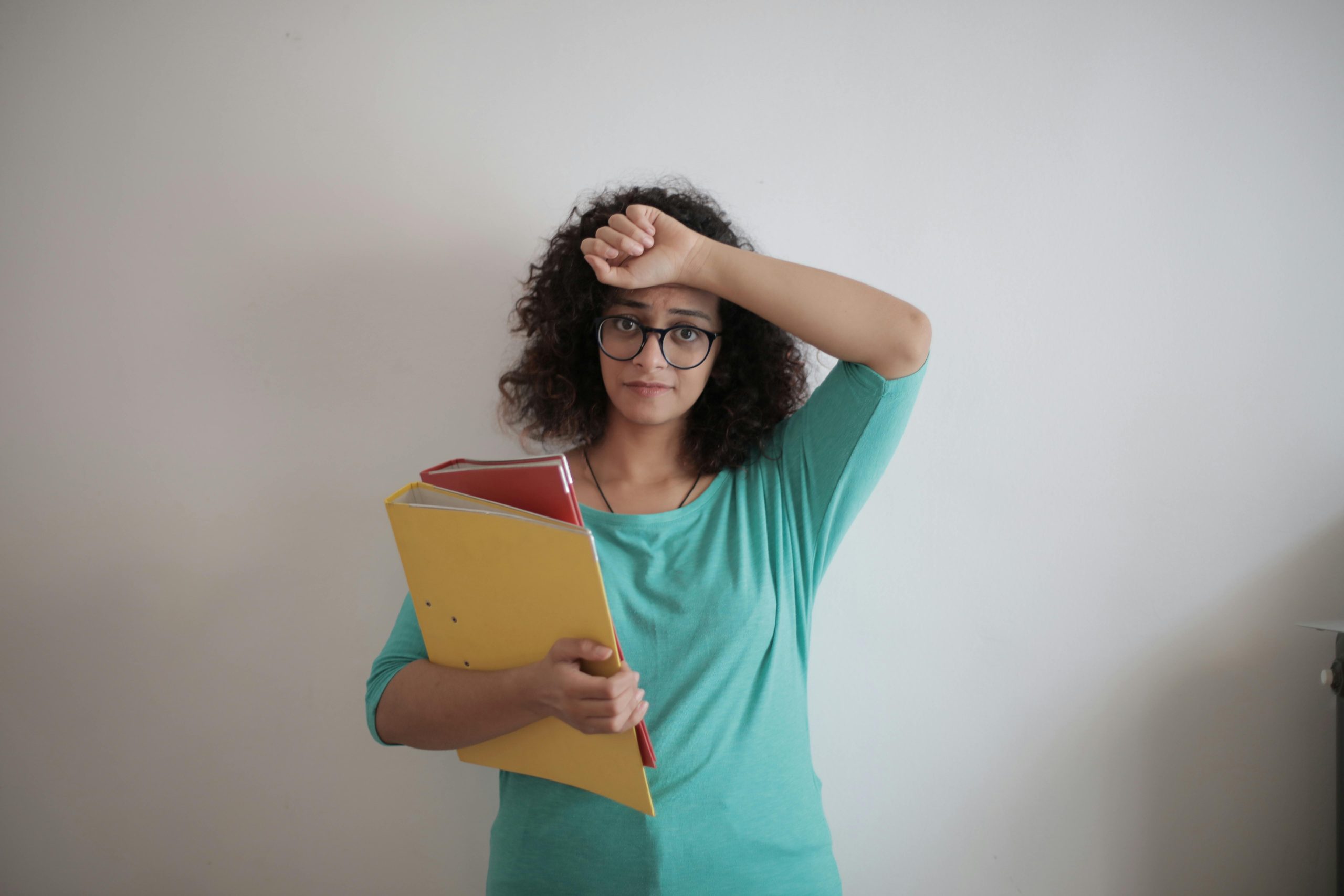 accountant holding files with her right hand