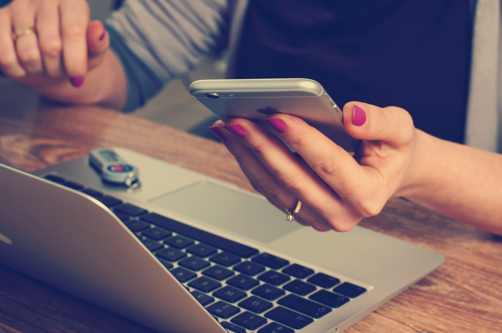 accountant reading her cellphone while working