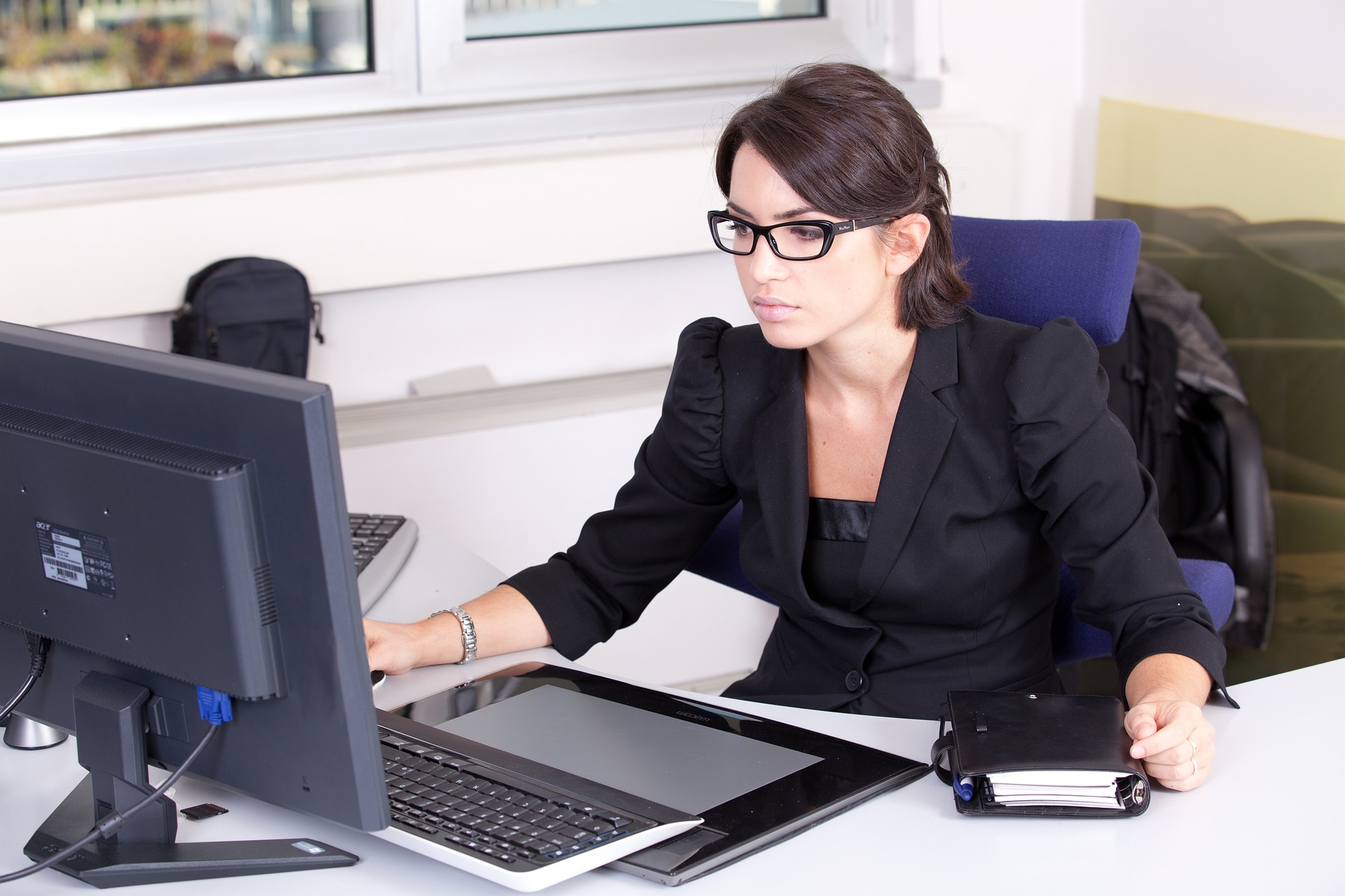 female accountant working using a laptop